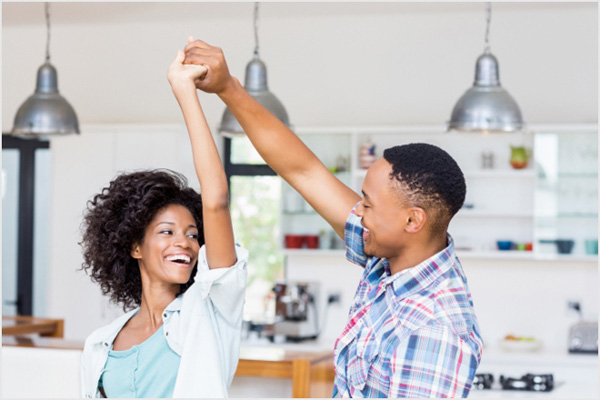 Couple dancing in new home