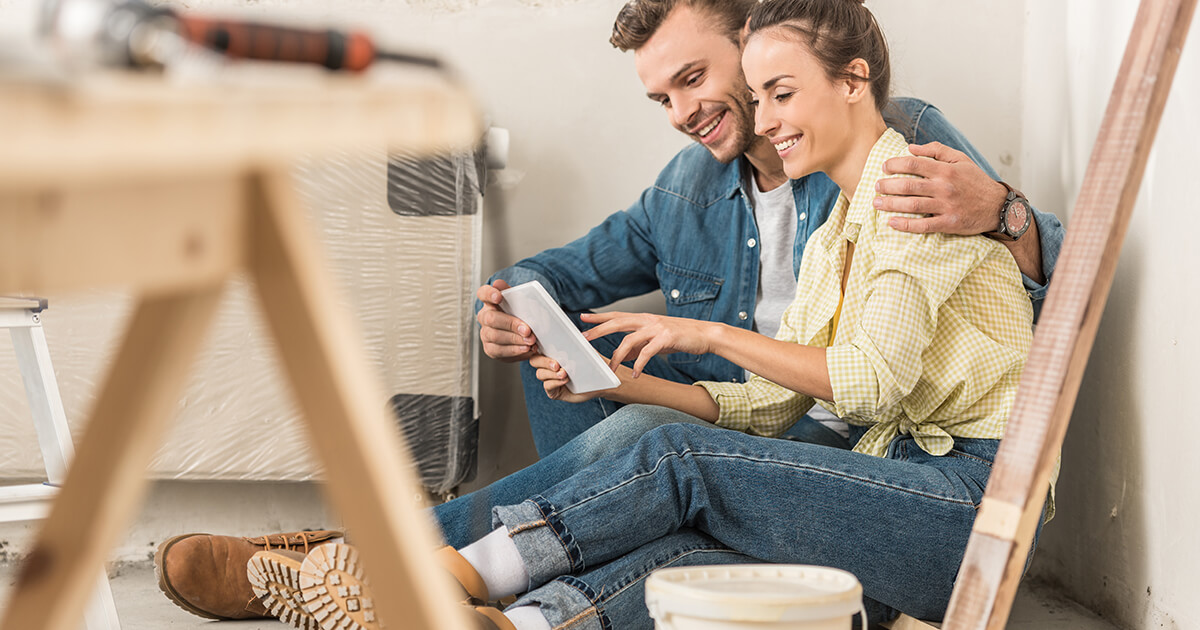 Couple sitting on the floor in a new home