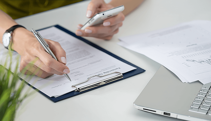 Woman reviewing personal finances with online banking tool