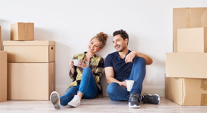 Couple enjoying coffee in new home