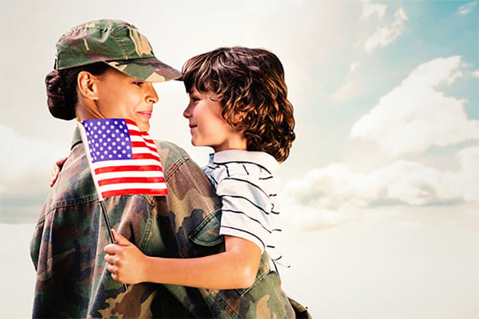 Mom in uniform hugging son