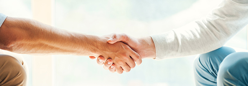 Closeup of two men shaking hands