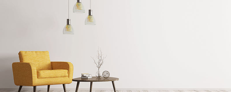 Yellow armchair and table under modern lighting