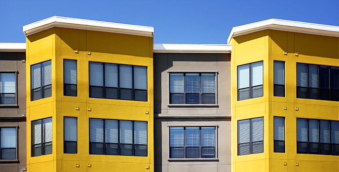 gray and yellow condo complex