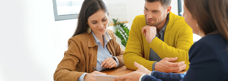 Couple discussing options with loan officer