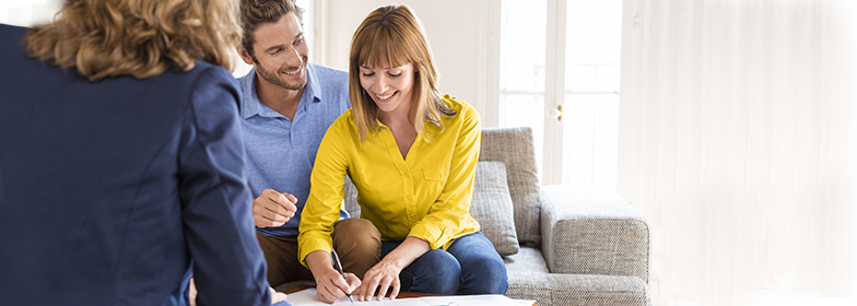 Couple receiving deed to their new home