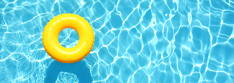 A pool tube floating in a pool.