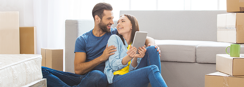 A couple embracing while on the iPad