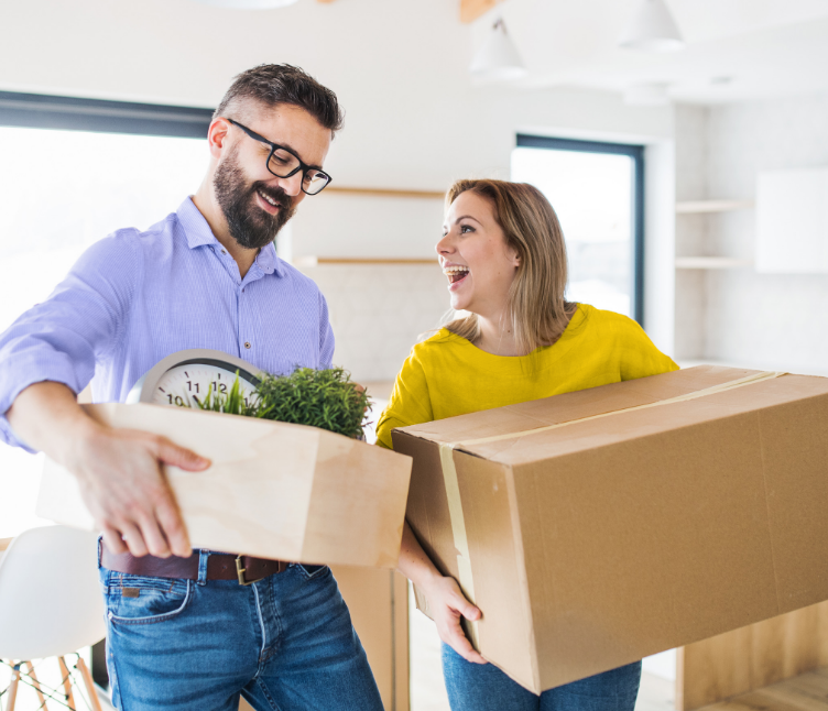 Smiling couple moving in