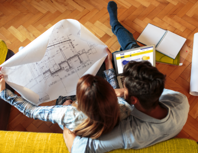 Couple looking at blueprints