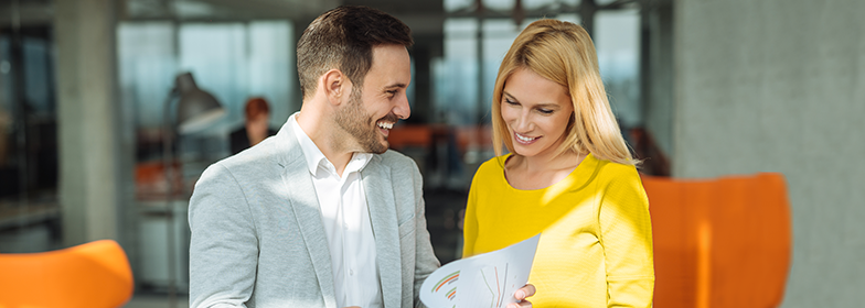 Woman and man looking at a document together